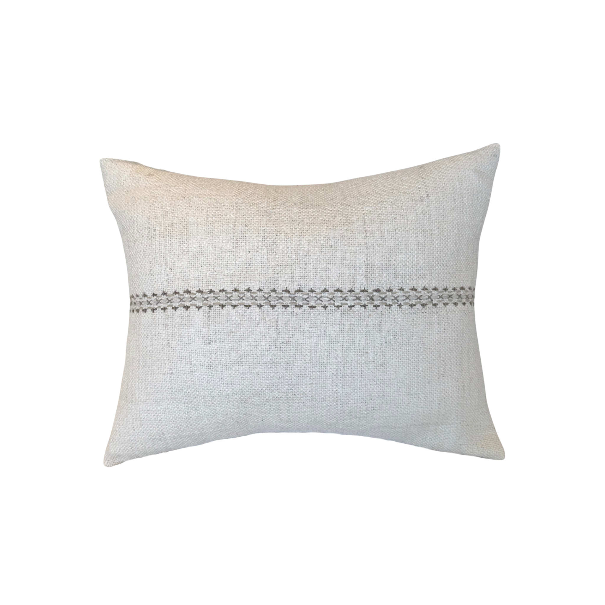 Textured cream colored pillow with decorative stitching.