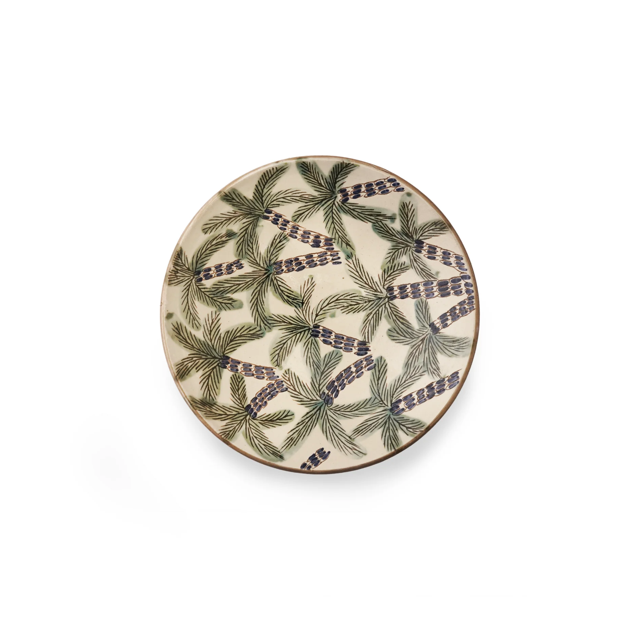 Round ceramic plate with green leaf pattern on a white background