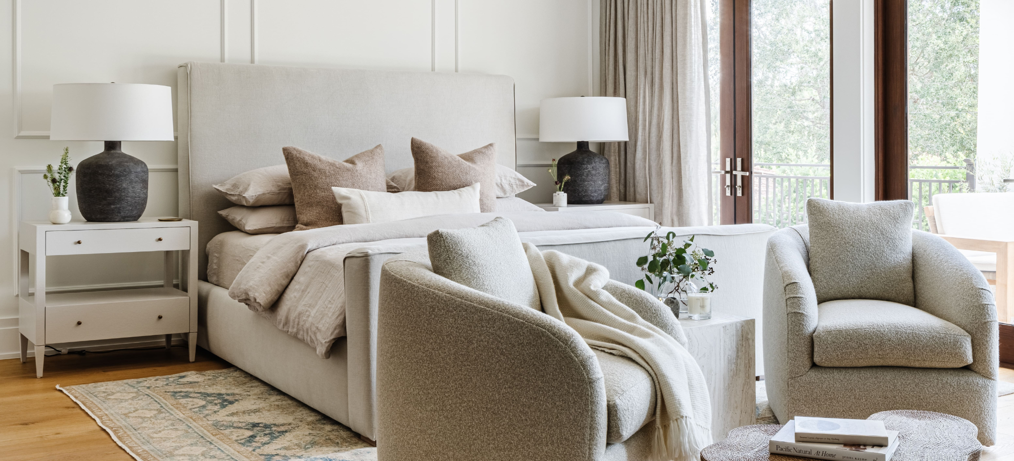 Cozy living room with beige sofa, armchair, and coffee table.