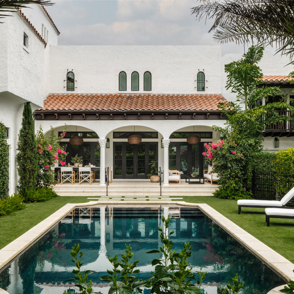 Pool and arched loggia of Villa Belmonte, a 1920s Mediterranean residence featured in Luxe Magazine