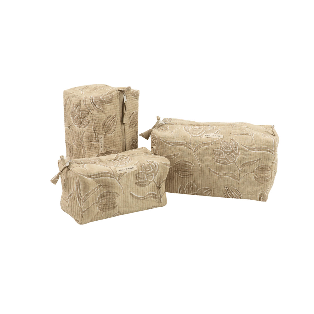 Maison Poire Astrid quilted toiletry bags in Sand with a tonal floral pattern, shown in three sizes