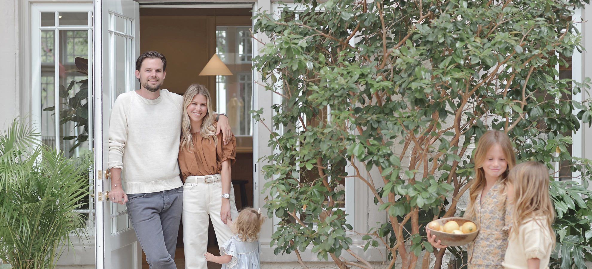 Founders Gustaf Svensson and Monique Miller with their daughters at their home's front door
