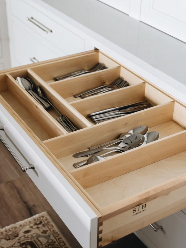 Wood flatware insert organizing cutlery in a Townhouse Line custom cabinetry drawer