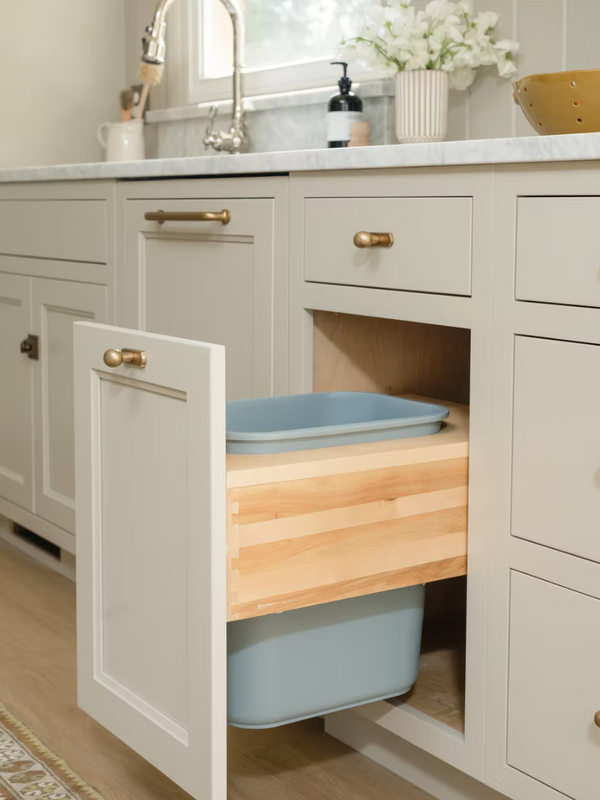 Pull-out waste bin cabinet in Townhouse Line custom cabinetry by Calimia Home