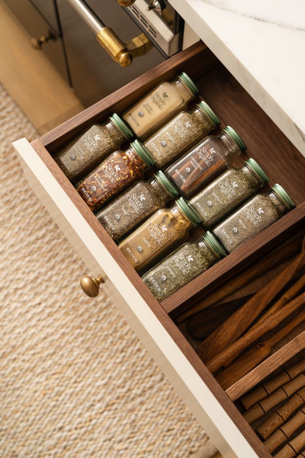 Dovetailed walnut spice drawer insert in a Stoffer Home Cabinetry custom kitchen
