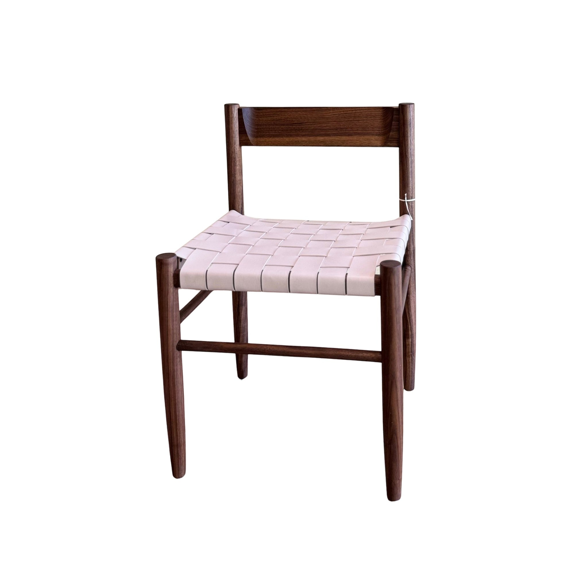 Calimia Home Gaon chair featuring a dark walnut wood frame and a woven cream leather seat in a modern minimalist style.