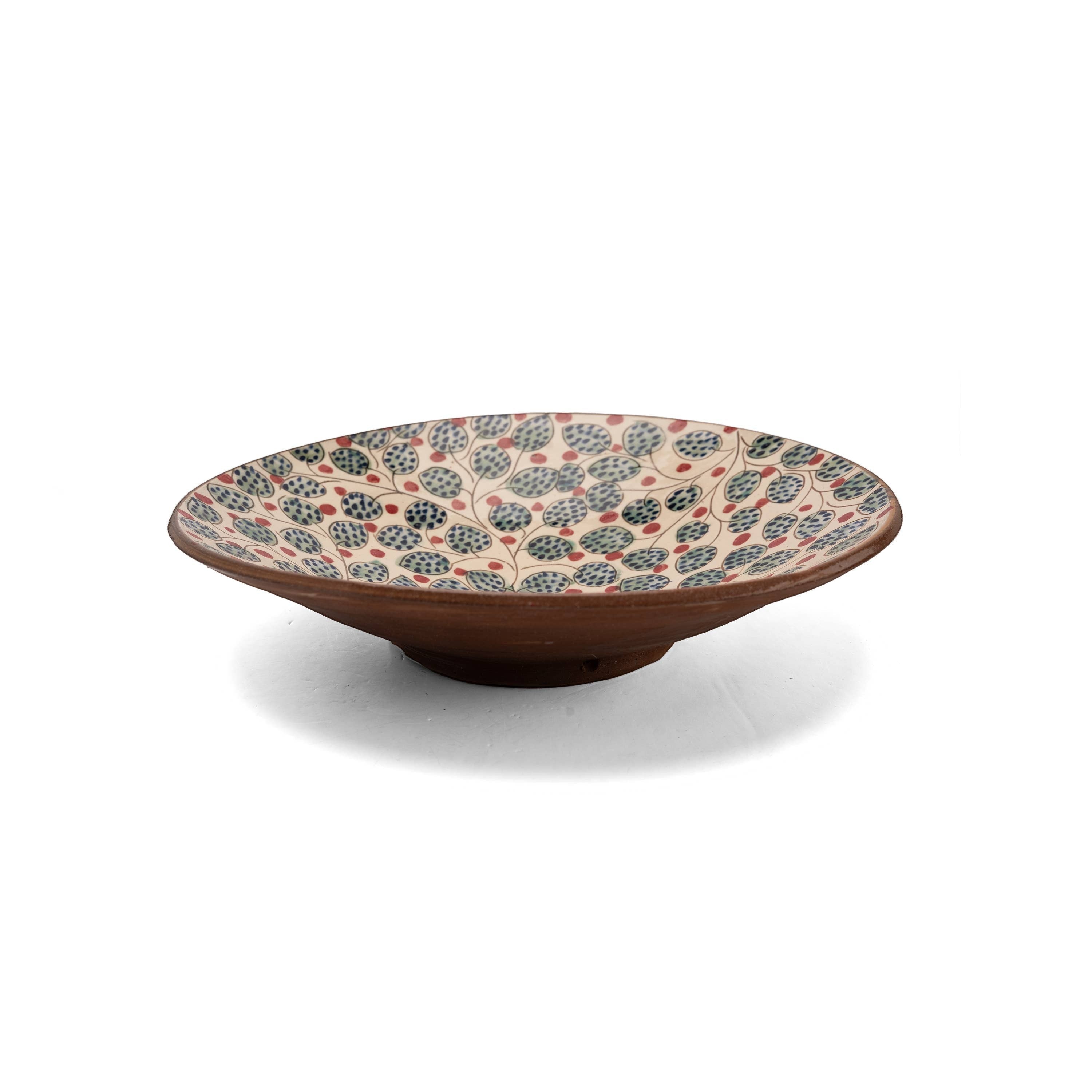 Kiliim handcrafted ceramic serving plate with hand-painted cherry and leaf motif in blue, green, and red.