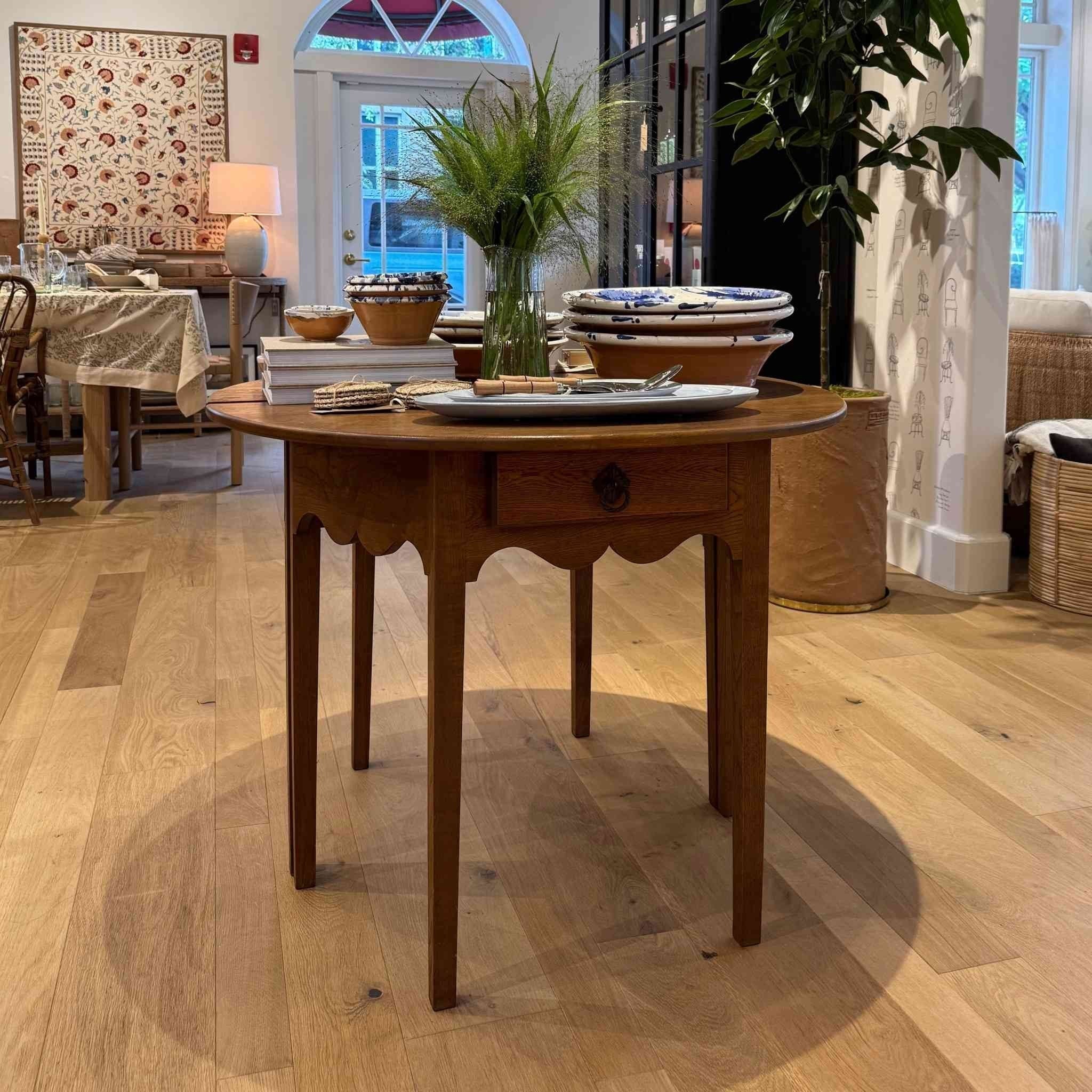 Demi vintage solid wood table with scalloped detailing and brass drawer pull