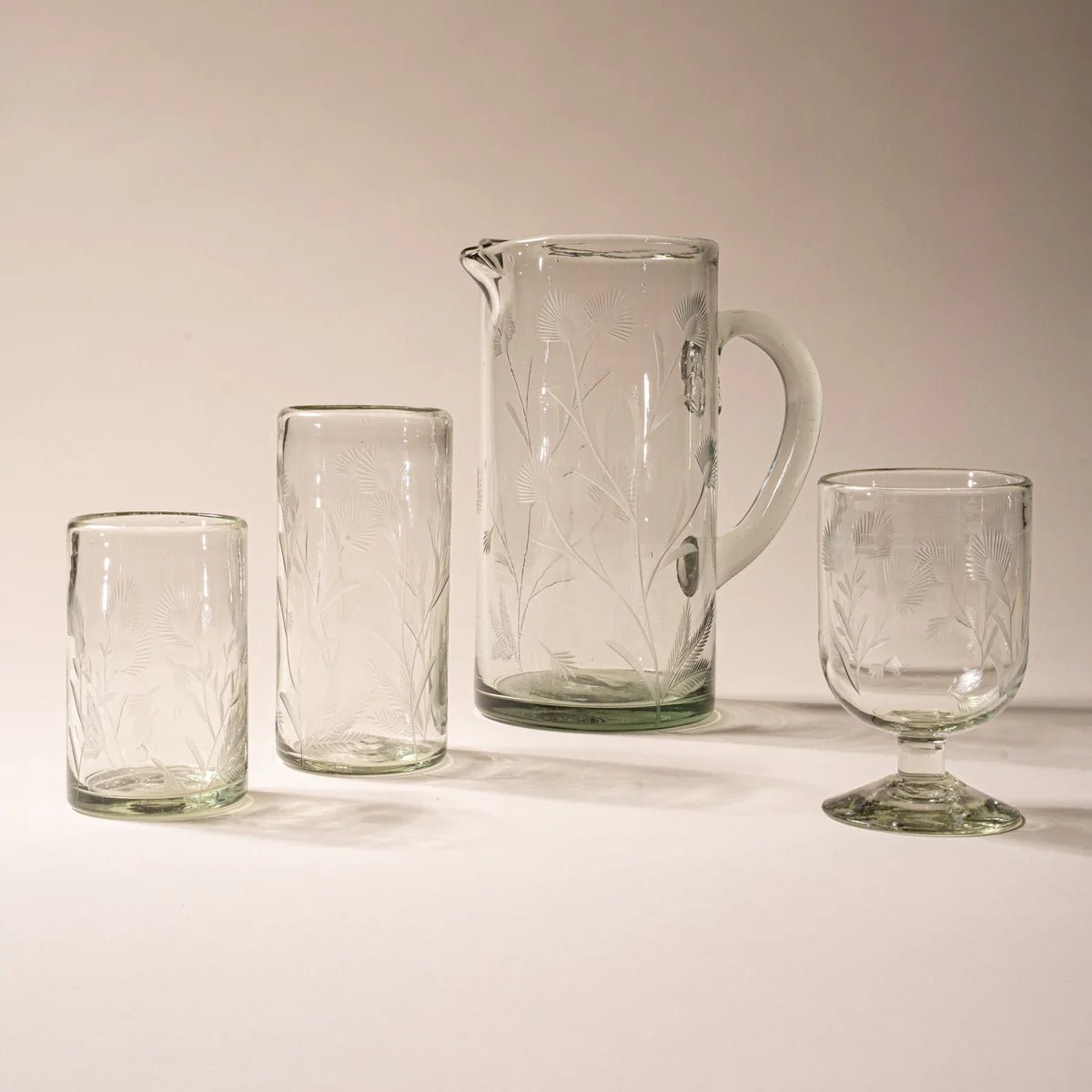 Close-up of the etched thistle pattern on the hand-blown glass pitcher