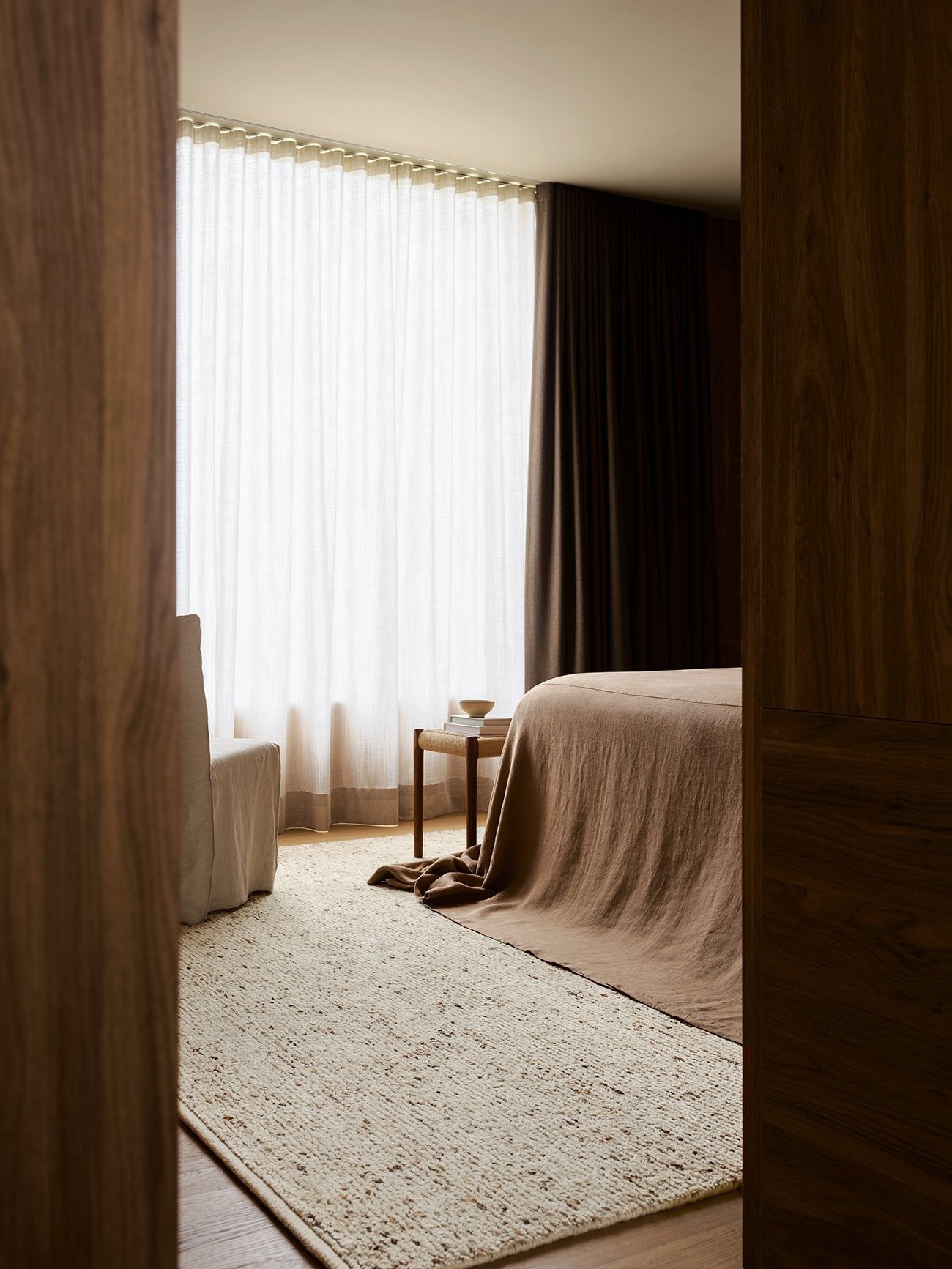 Armadillo Faroe Rug in Foal, hand-knotted undyed wool rug shown in a room setting