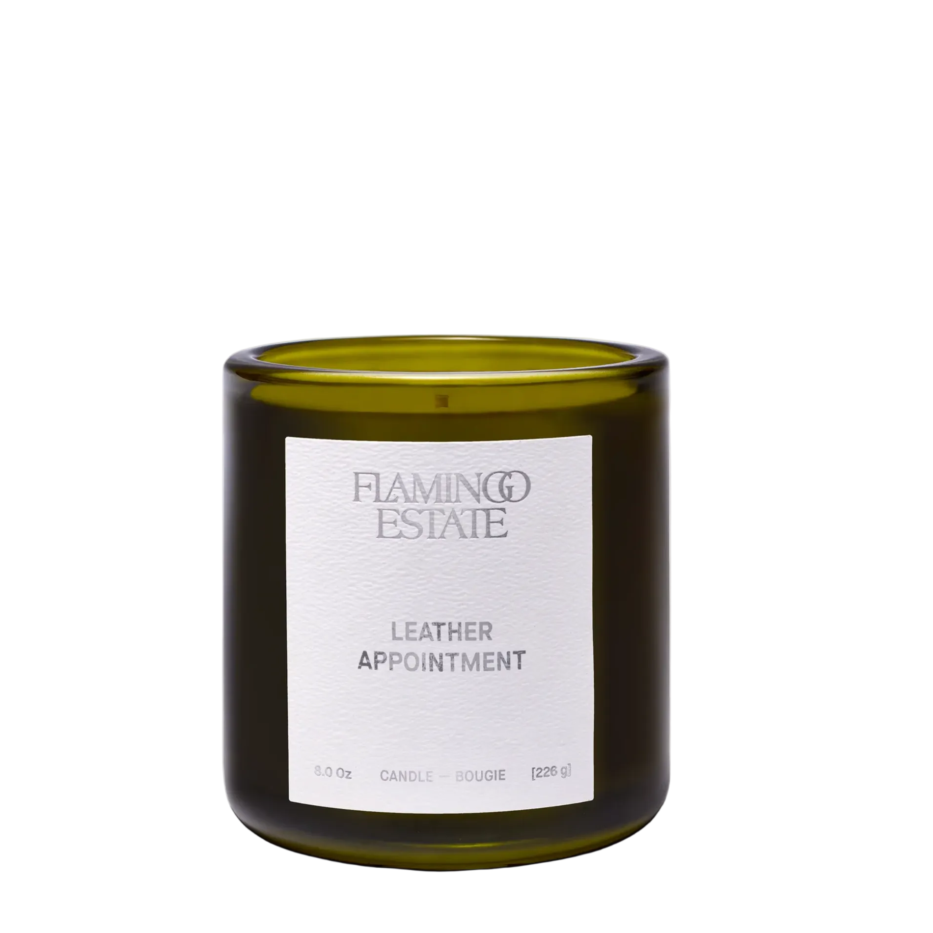 Leather Appointment Candle by Flamingo Estate, 8 oz vegetable wax candle in fluted forest-green glass, bitter orange and suede fragrance