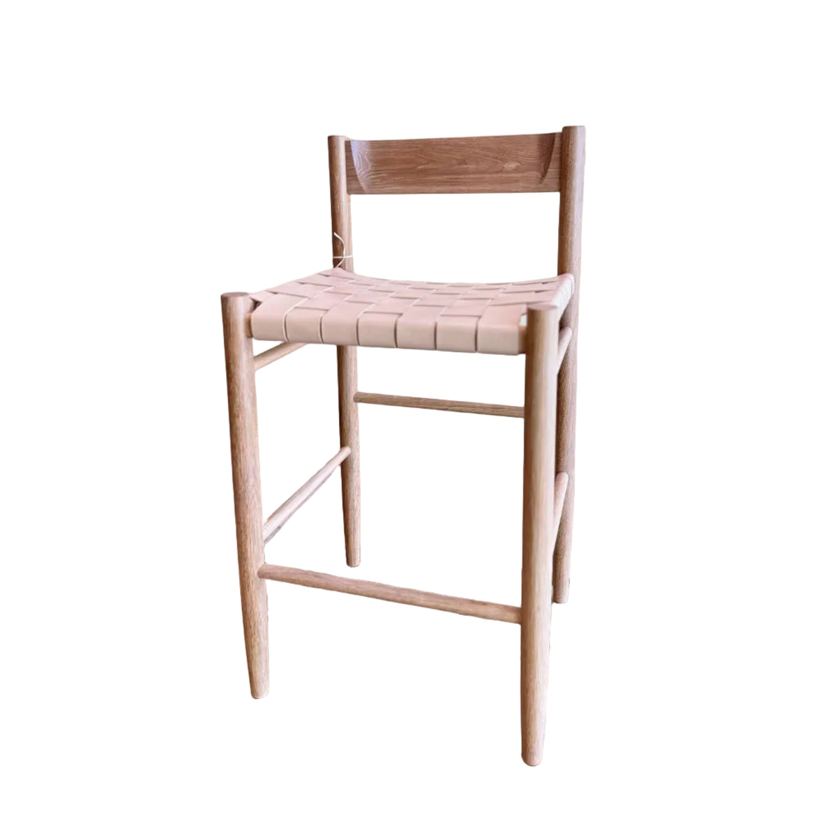 Calimia Home Gaon counter stool with a solid white oak frame and a woven natural leather seat and backrest.