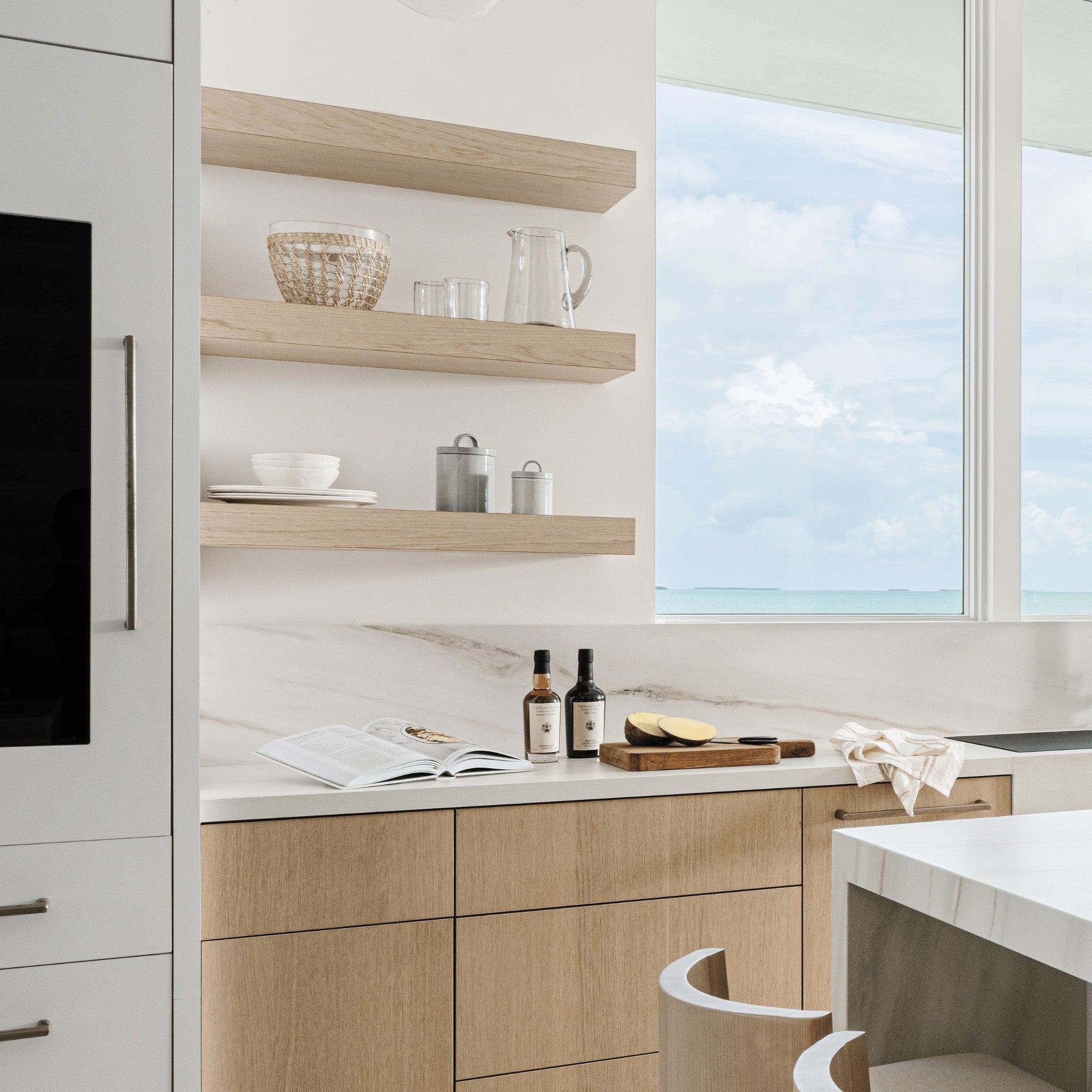 Calimia Home hand-blown clear recycled glass rock glass on a modern kitchen shelf