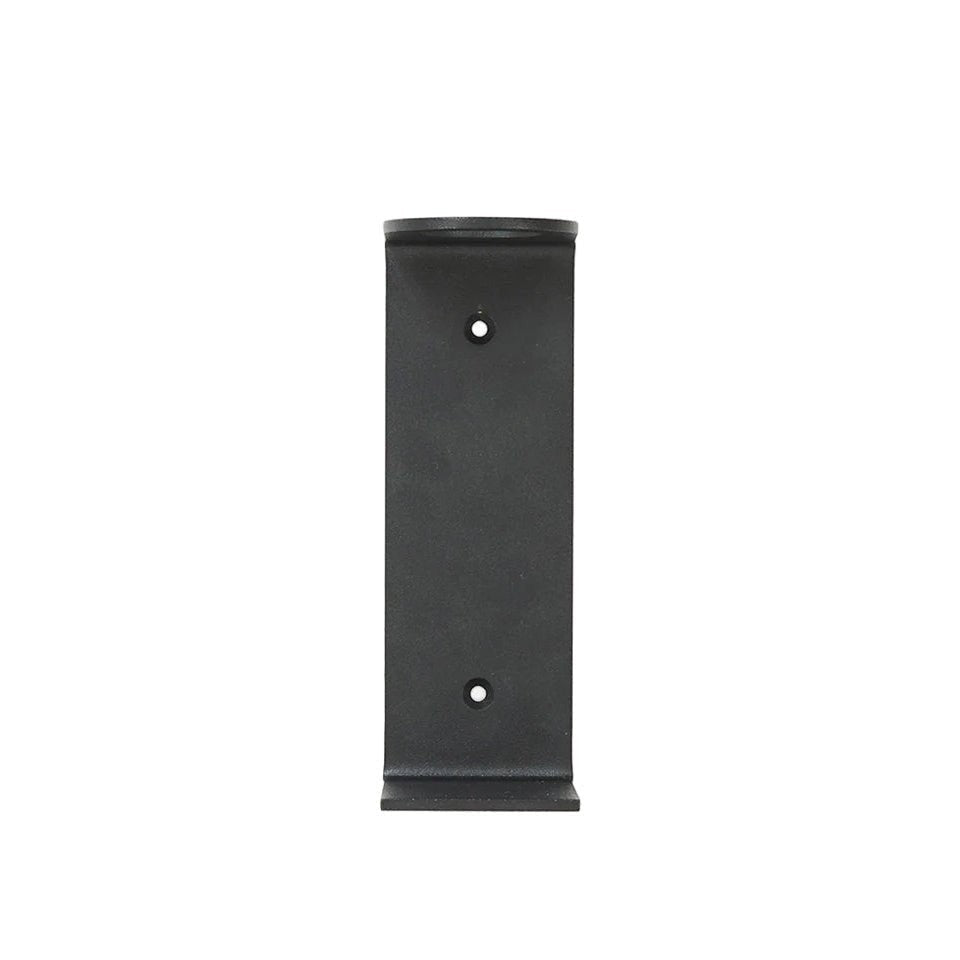 Frama minimalist wall mounted bottle holder bracket in matte black metal for bathroom or kitchen organization.