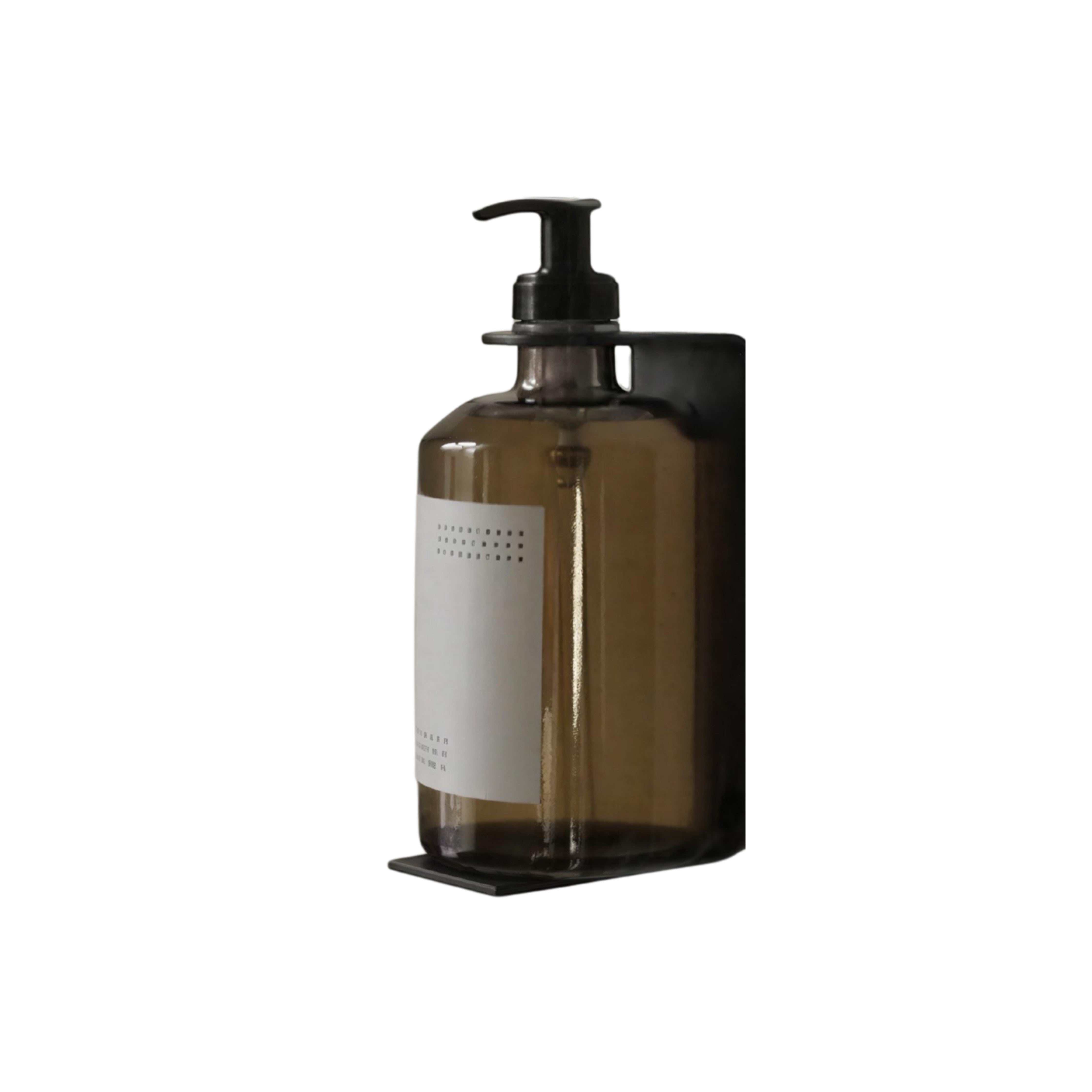 Calimia Home minimalist matte black wall-mounted metal bracket holding a translucent brown soap bottle