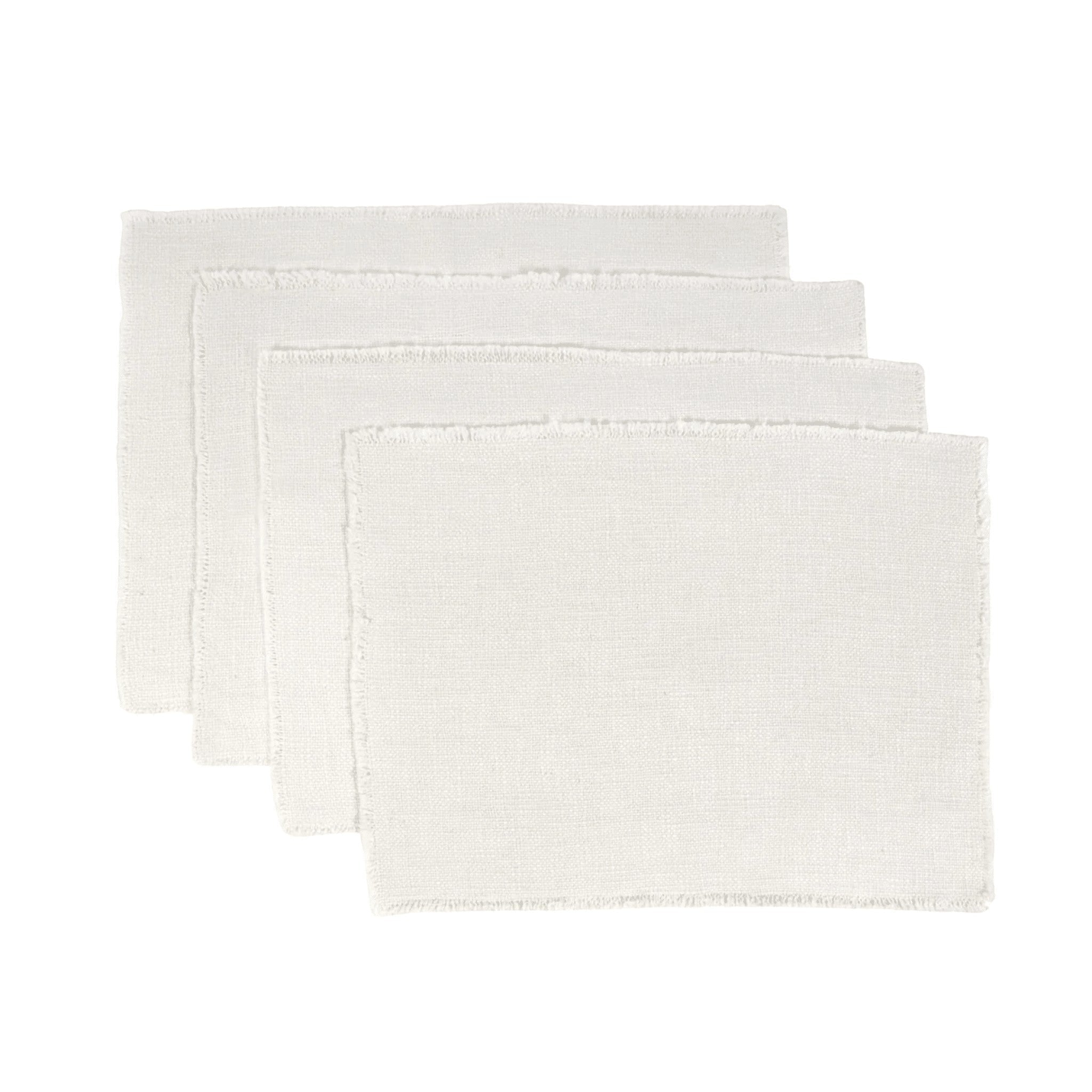 Set of four Pom Pom At Home ivory placemats in a linen-cotton blend with frayed edges and a soft, heavyweight weave.