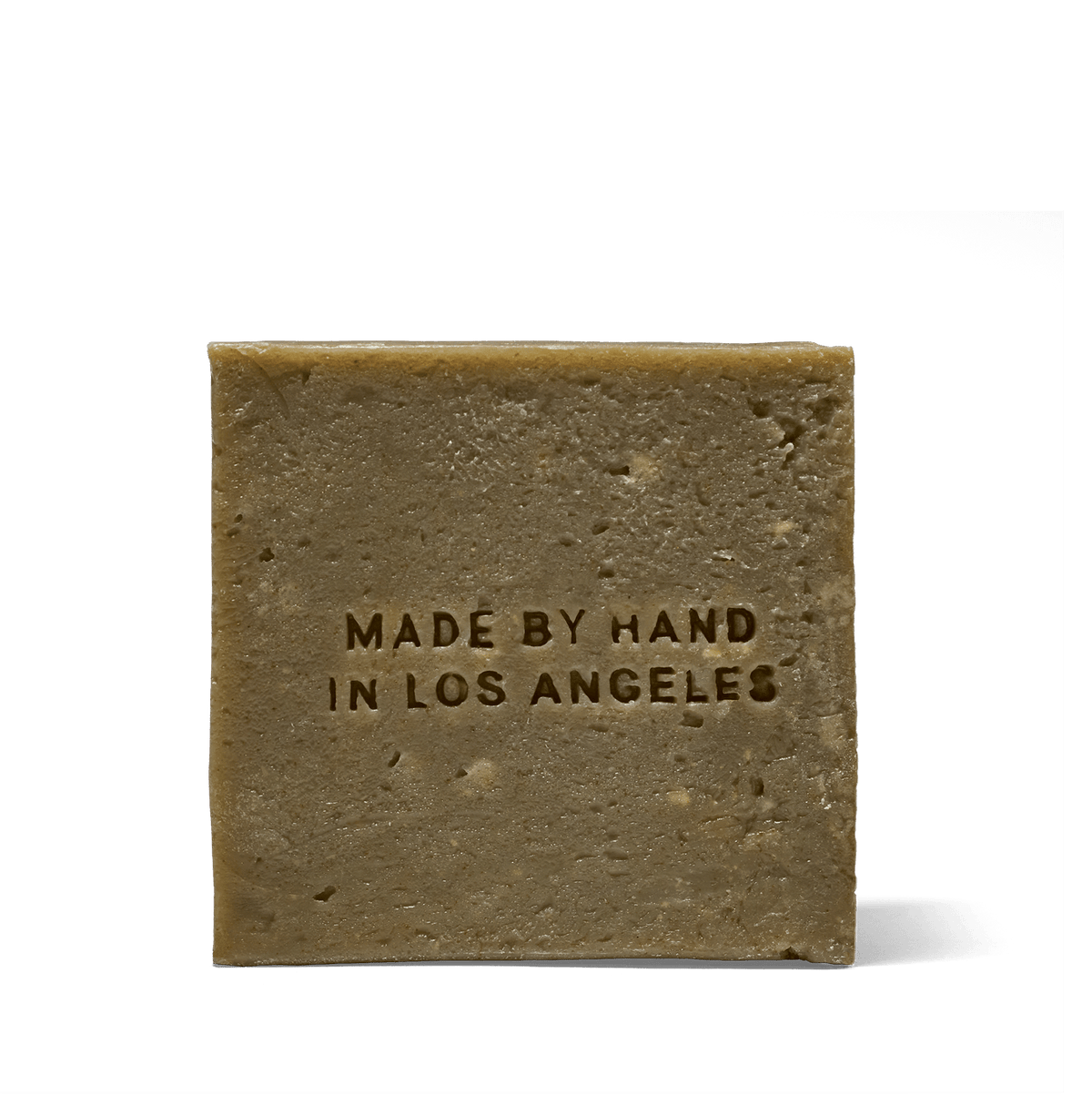 Back of the Flamingo Estate Rosemary & Parsley Soap Brick, embossed Made by Hand in Los Angeles.