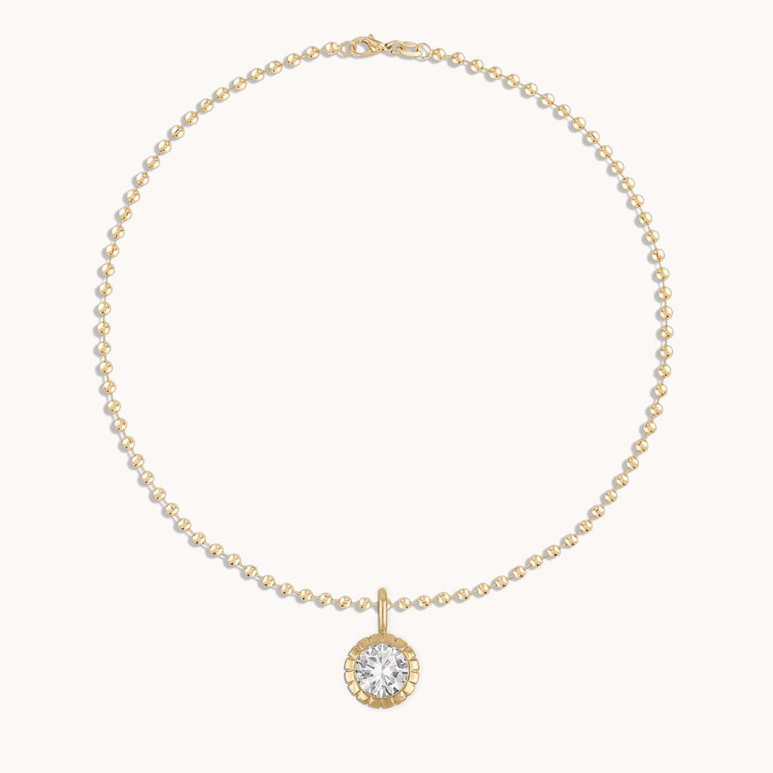 Close-up view of ball chain showing bezel-set crystal details