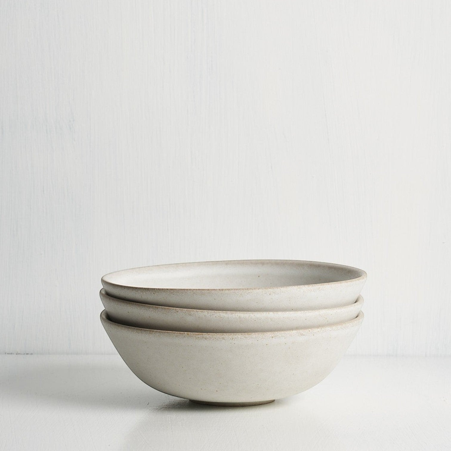 Small bowl side view showing curved silhouette and glaze detail