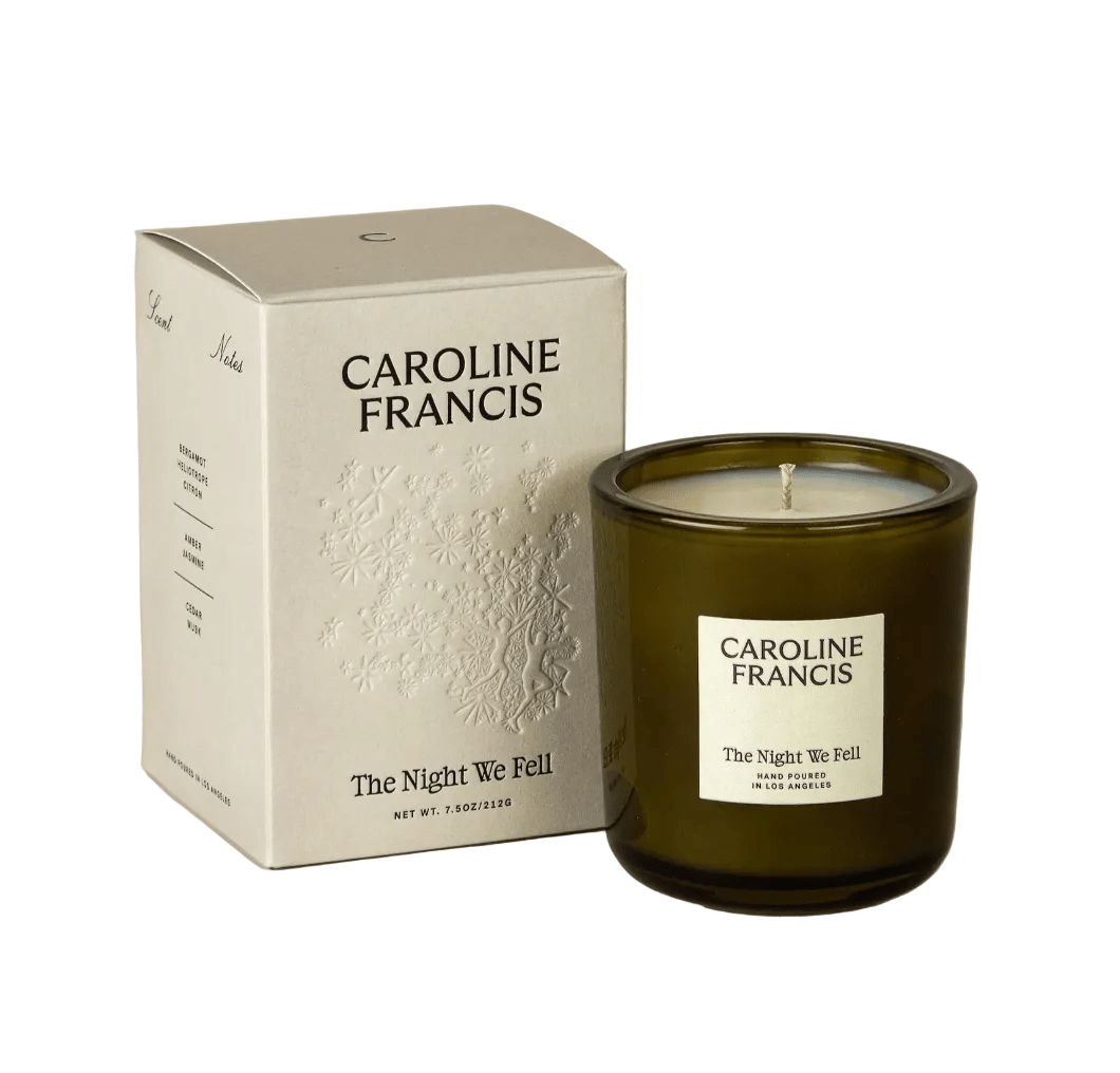 Caroline Francis candle and packaging on a beige background