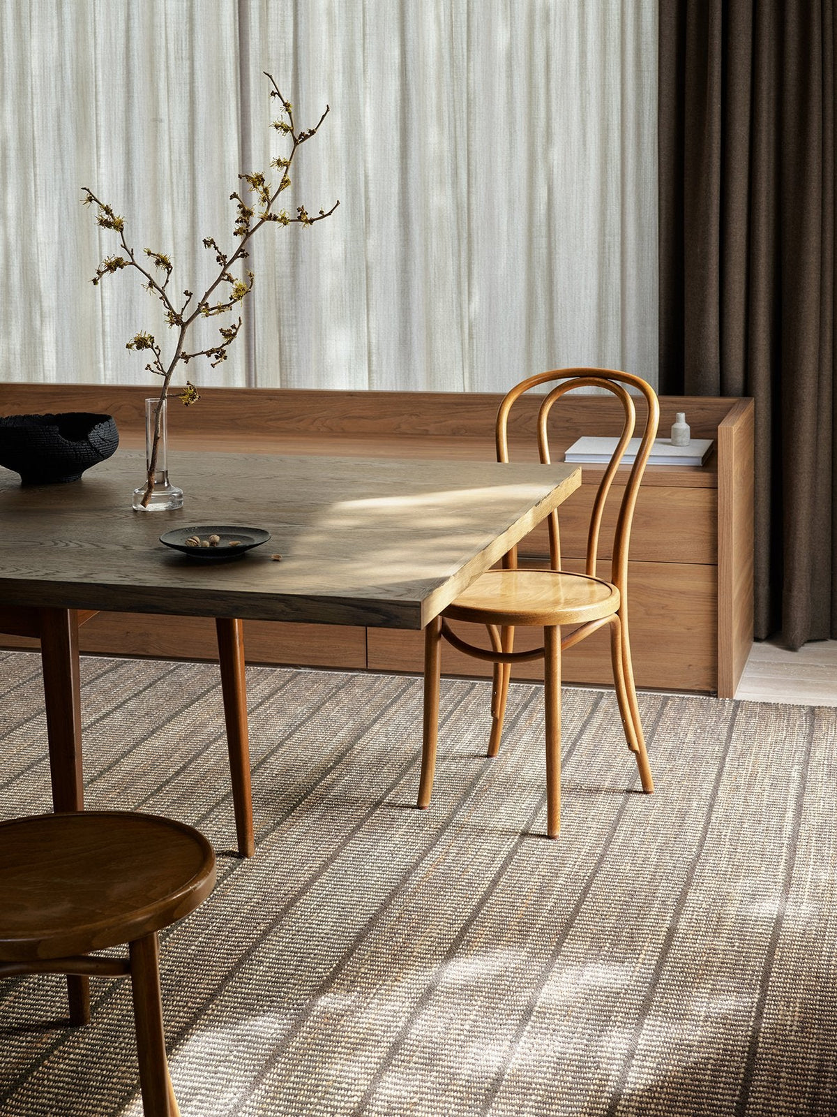 Armadillo Trellis Rug in Natural & Bison, handwoven wool and jute rug shown in a room setting