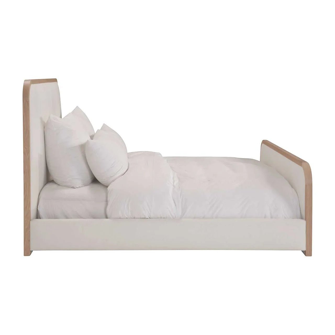 Calimia Home Vance Bed with curved upholstered headboard, footboard, and solid oak trim in a side profile view.