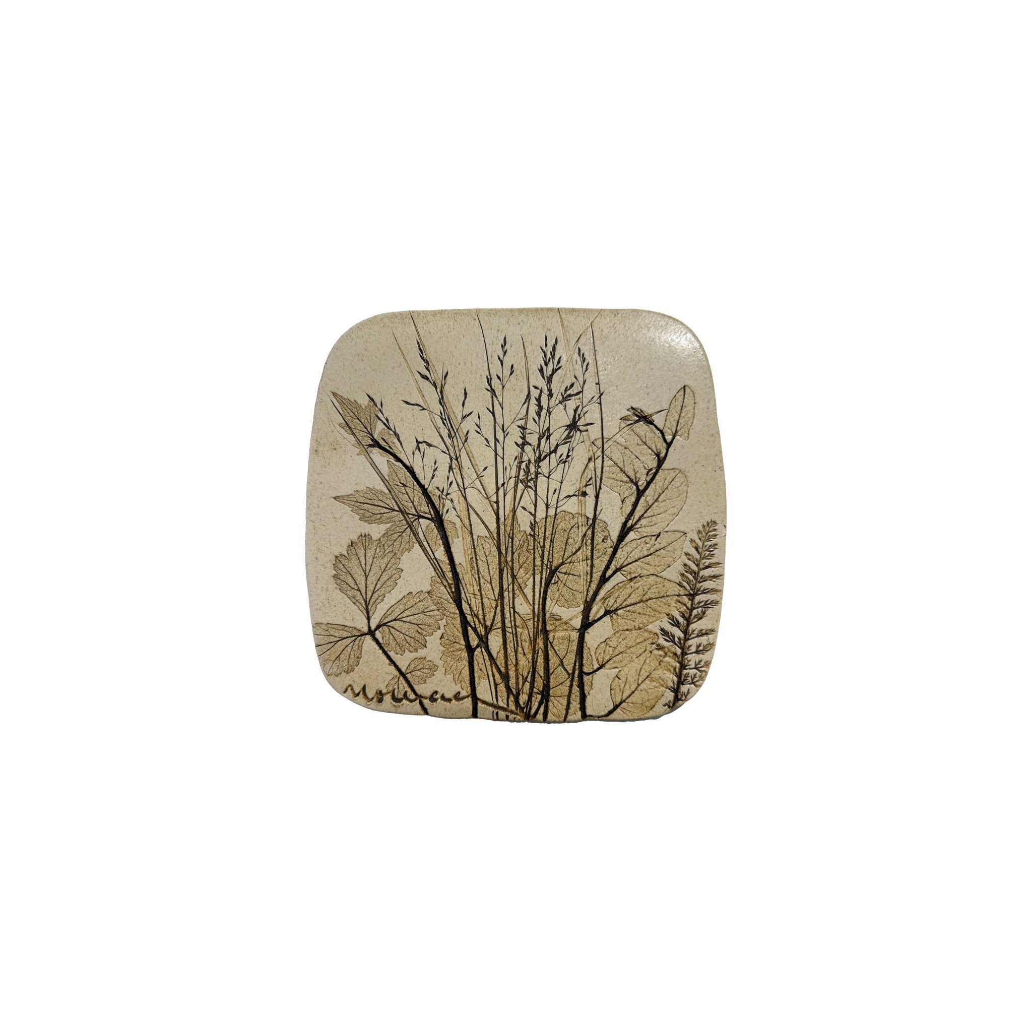 Vintage ceramic botanical wall tile with fine meadow grasses in seed and a fern frond pressed into speckled cream stoneware, the largest of three