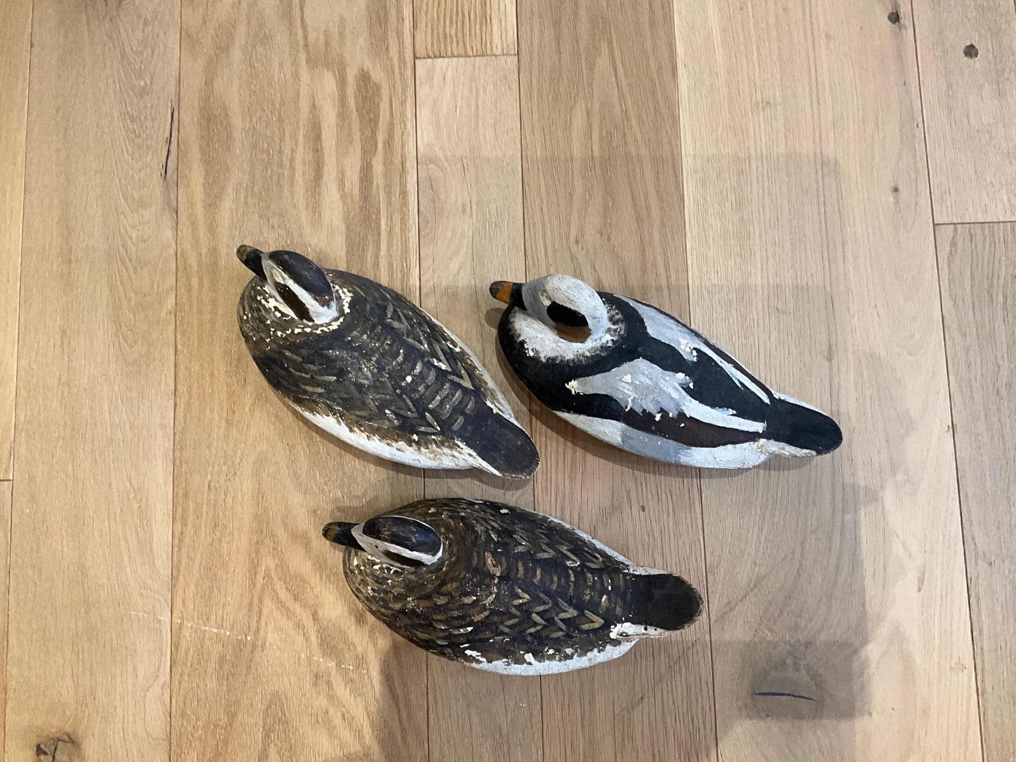 Vintage carved wood decoy ducks — hand-painted