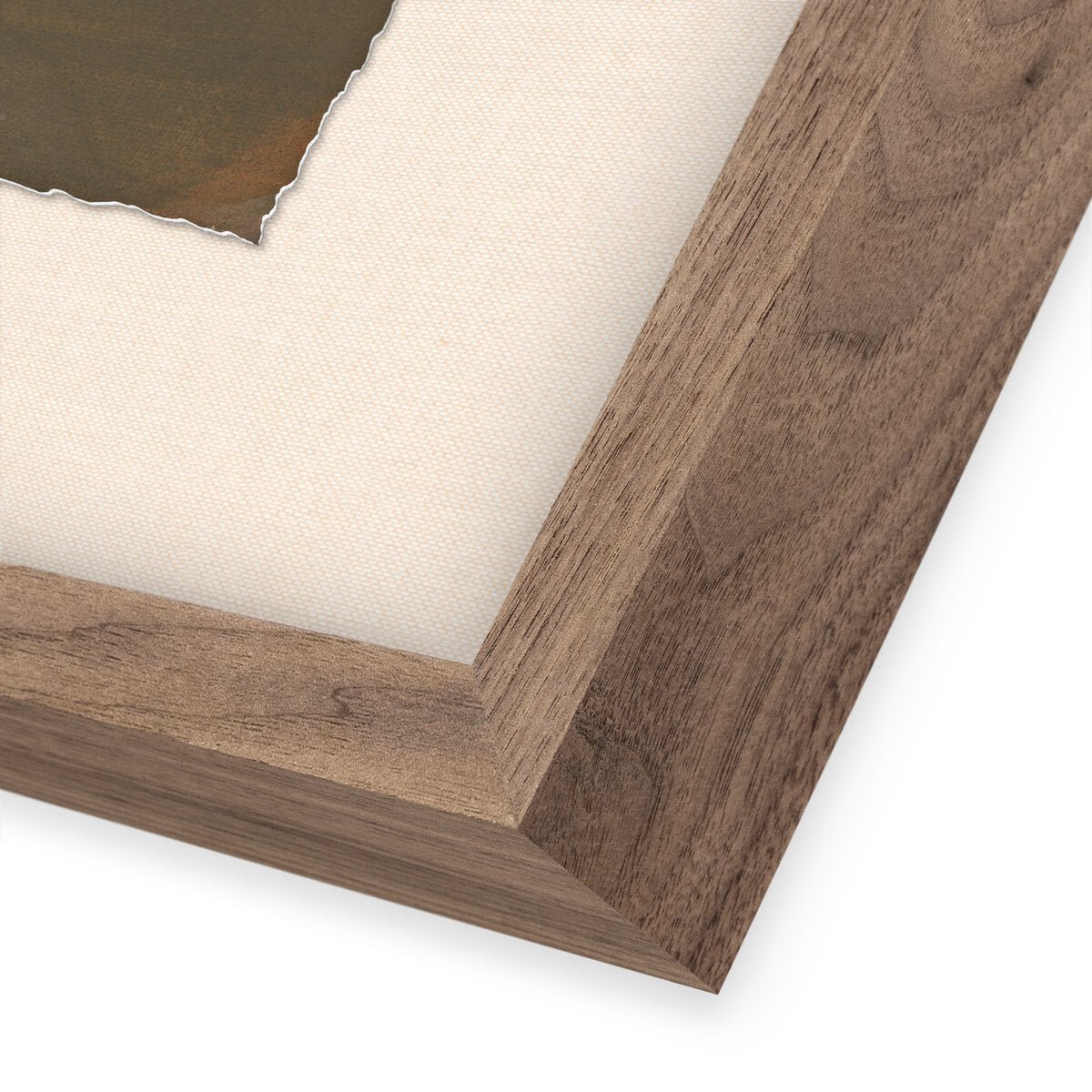 Corner detail of the Worn Triptych by Brooke Noel Morgan showing a walnut wood frame, off-white canvas mat, and the deckled edge of the print in olive and brown tones.