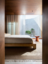 Armadillo Willow Rug in Cumin, handwoven flatweave rug shown in a room setting