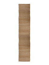 Armadillo Nest Nook Rug in Natural, overhead view of the handwoven jute flatweave weave and edge finish