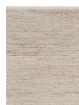 Armadillo Camino Rug in Sawdust, corner close-up of the undyed new zealand and european wool pile and edge
