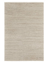 Armadillo Camino Rug in Sawdust, a second view of the cut pile undyed wool rug in a styled interior
