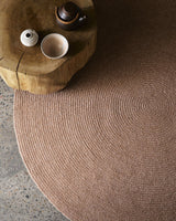 Braid Rug by Armadillo, hand-braided wool blend rug, styled in a room at Calimia Home
