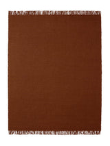 Armadillo Willow Rug in Henna, a second view of the handwoven flatweave rug in a styled interior