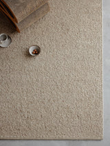 Armadillo Pebble Rug in Whippet, a second view of the handwoven boucle wool rug in a styled interior