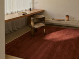 Armadillo Agra Rug in Burnt Umber, overhead view of the hand-knotted wool weave and edge finish