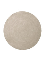 Armadillo Braid Rug in Mushroom, a second view of the hand-braided wool blend rug in a styled interior