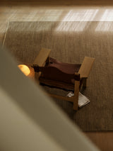 Sagrada Rug by Armadillo, hand-knotted wool cut pile rug, styled in a room at Calimia Home