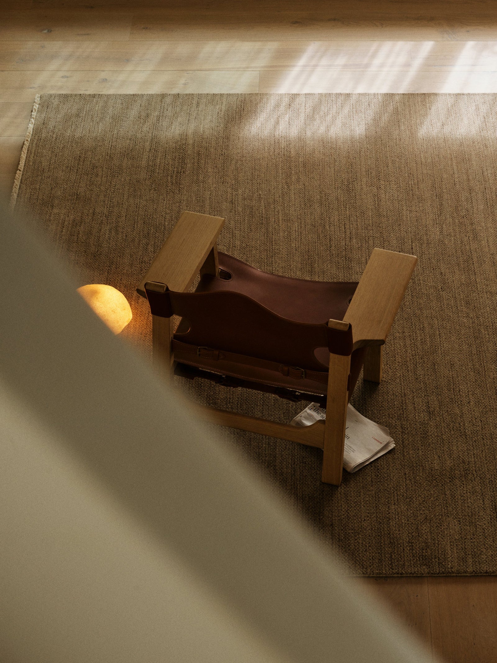 Sagrada Rug by Armadillo, hand-knotted wool cut pile rug, styled in a room at Calimia Home