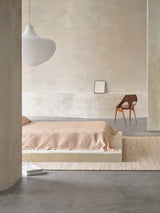 Armadillo Drift Rug in Natural & White, handwoven jute and wool rug shown in a room setting
