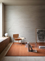 Armadillo Cable Rug in Bisque, handwoven soumak wool rug shown in a room setting
