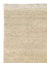 Armadillo Mojave Rug in Cashew, corner close-up of the jute pile and edge