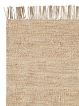Armadillo Willow Rug in Eggshell, corner close-up of the linen, wool, and jute pile and edge