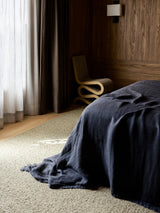 Pebble Rug by Armadillo, handwoven boucle wool rug, styled in a room at Calimia Home