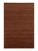 Armadillo Thatch Rug in Copper, overhead view of the hand-knotted wool weave and edge finish
