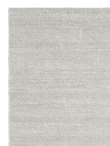 Armadillo Latitude Rug in Beluga, corner close-up of the linen pile and edge