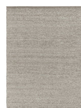 Armadillo Field Rug in Brindle, corner close-up of the rws-certified undyed european wool pile and edge