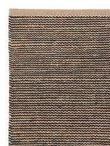 Armadillo Drift Nook Rug in Natural & Black, corner close-up of the jute and wool pile and edge