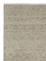 Armadillo Sonata Rug in Wisp, corner close-up of the hand-spun afghan wool pile and edge